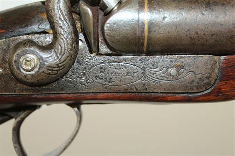 Two filler tubes with rammers. . John romans antique guns